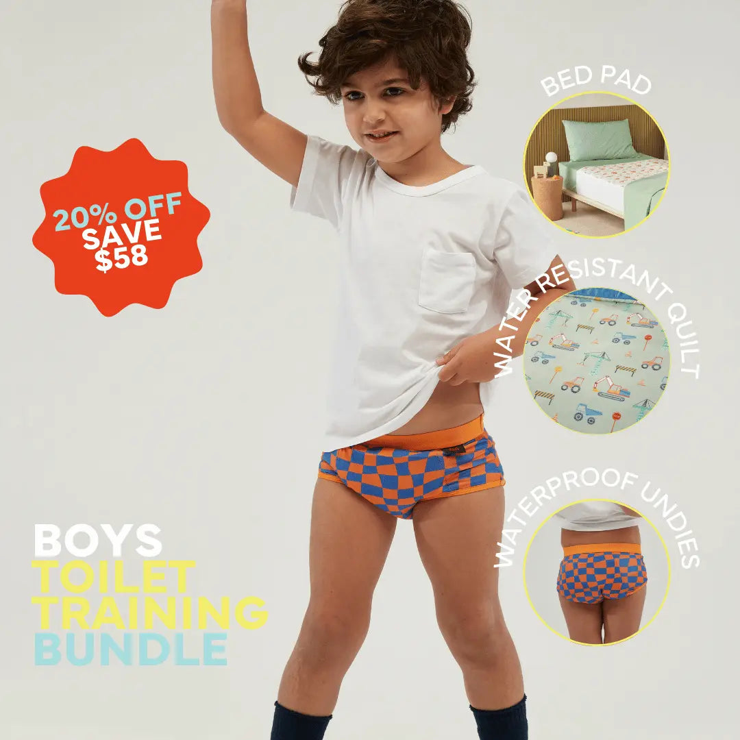 Staydry Boys' Toilet Training Bundle promotion. A young boy in a white t-shirt and blue-and-orange checkerboard waterproof underwear.