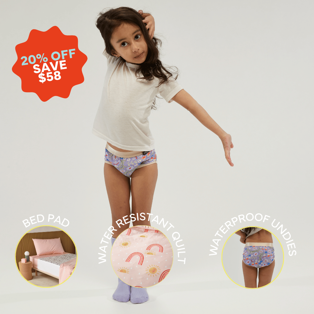 StayDry Girls' Toilet Training Bundle promotion. A young girl in a white t-shirt and pastel waterproof underwear with a floral print.