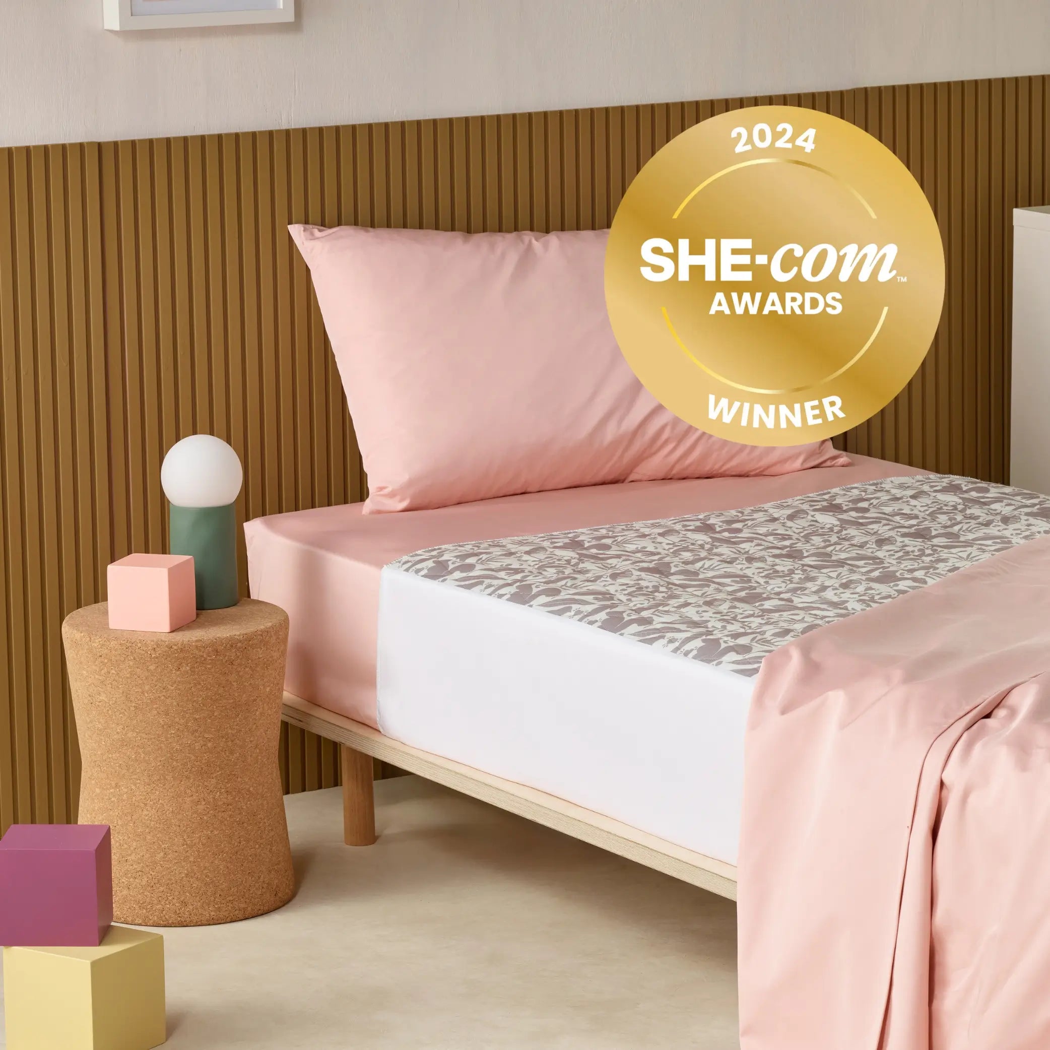 Award-winning kids waterproof absorbent bed pad also known as Kylie pad with a delicate floral pattern. This SHE-com Award-winning reusable leak-proof mattress protector is perfect for bedwetting, toilet training, and incontinence protection.