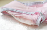 Pink briefs laying down and the absorbent section is visible