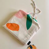 Fabric bag using the abstract print with a Staydry swing tag attached.