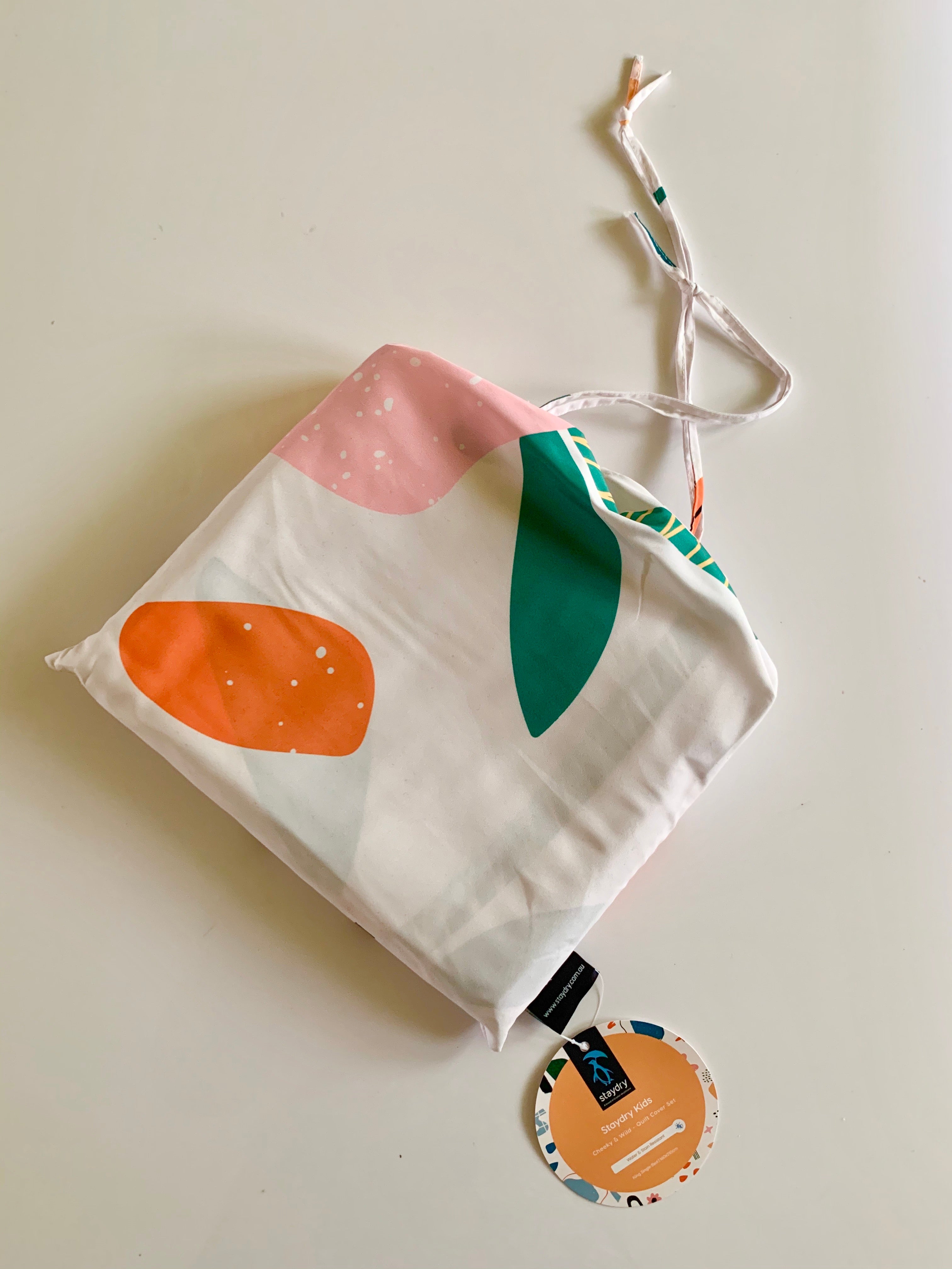Fabric bag using the abstract print with a Staydry swing tag attached.